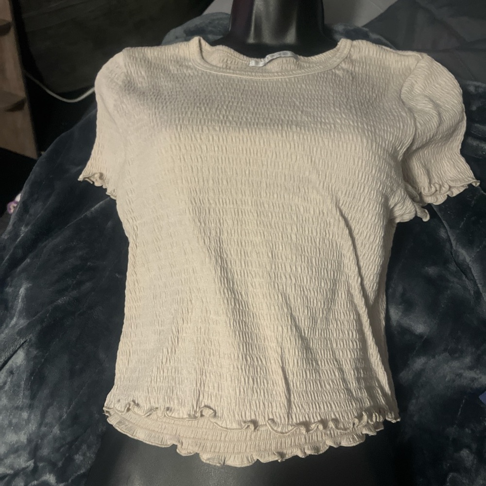 Cream ruffle crop top.